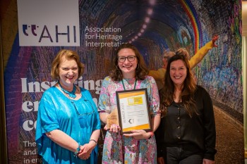 Katie Firth receiving the awards on behalf of Stromness Museum