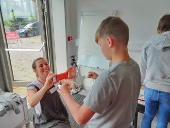 Lizzy filming one of the young participants’ thaumotrope. A Thaumotrope was a common 19th century toy. It’s created by drawing two still images, one on either side of a card. When the attached strings are twisted back and forth, the image appears as one. Lizzy filming one of the young participants’ thaumotrope. A Thaumotrope was a common 19th century toy. It’s created by drawing two still images, one on either side of a card. When the attached strings are twisted back and forth, the image appears as one