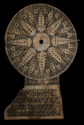 Traverse board A dark wooden traverse board used in navigation. The holes in the board are used for pegs.