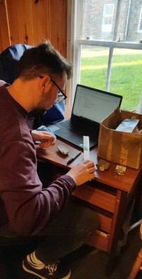 Volunteer Ruairidh cataloguing rock samples from the Ted Kellock collection.
