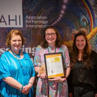 Katie Firth receiving the awards on behalf of Stromness Museum