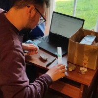 Volunteer Ruairidh cataloguing rock samples from the Ted Kellock collection.